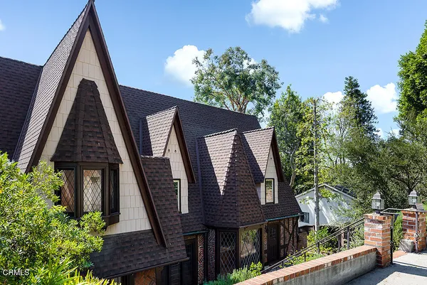 a view of a house with a door and wooden floor