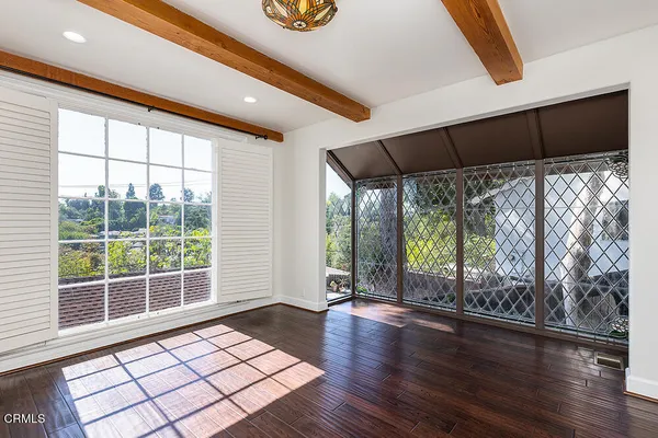 a bathroom with a granite countertop sink and a large mirror