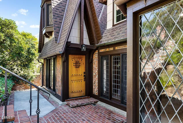 a view of an entryway with wooden floor