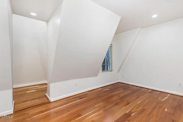 a view of washer and dryer with bathroom in the background