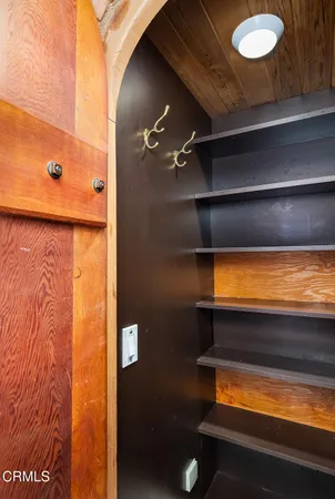 a en suite bathroom with a granite countertop sink and a mirror