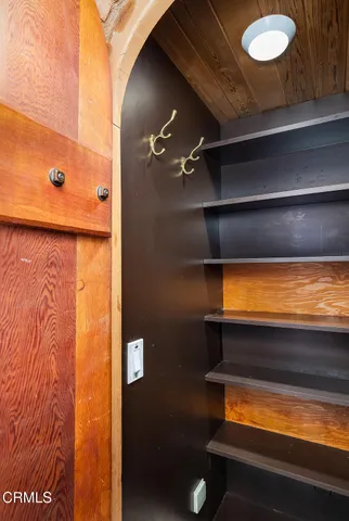 a en suite bathroom with a granite countertop sink and a mirror