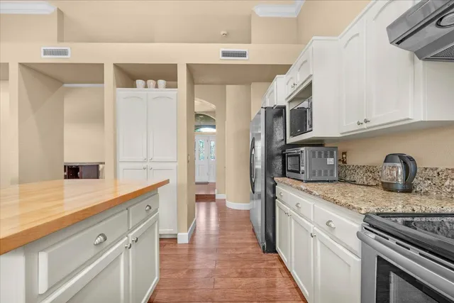 a living room with furniture a fireplace and a large window