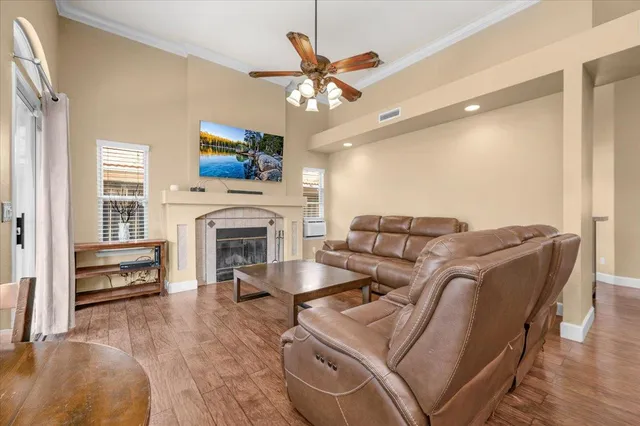 a living room with furniture and a fireplace
