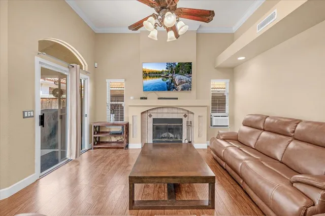 a living room with furniture and a table with kitchen view