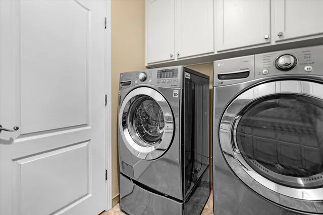 a bedroom with a bed and a chair with the bookshelf