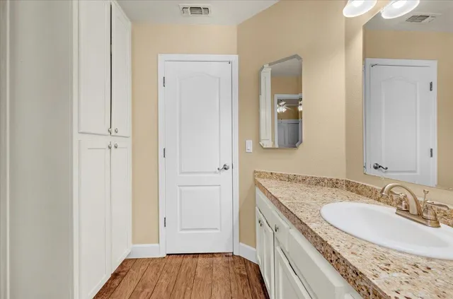 a bed sitting in a room next to a window