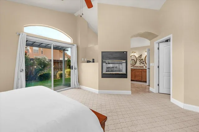 a view of backyard of house with outdoor seating and green space