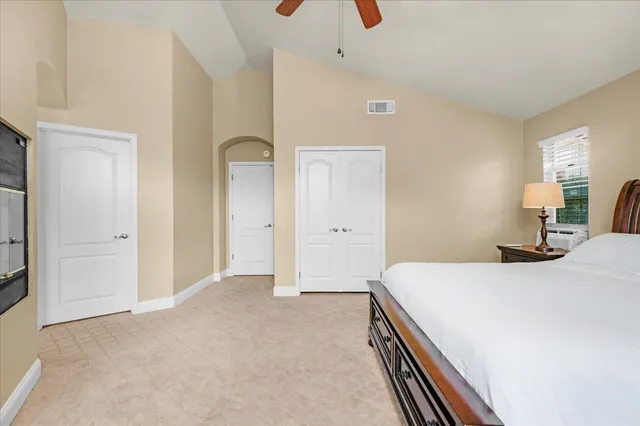 a view of house with backyard and glass windows