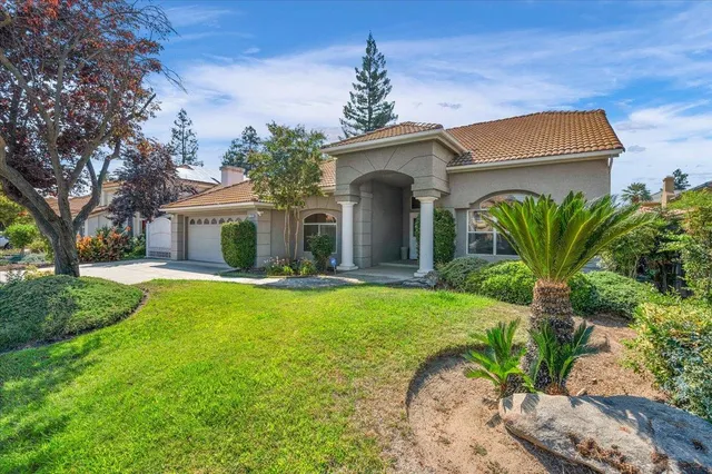 a view of a livingroom with furniture and a window