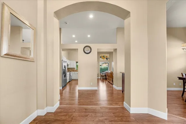 a view of a livingroom with furniture and a flat screen tv