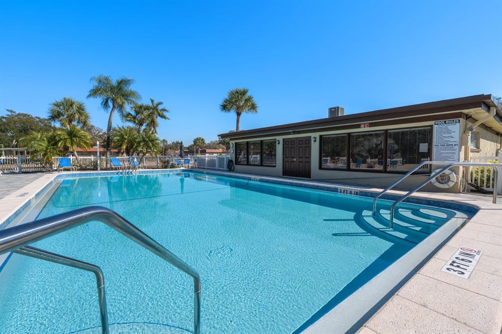 1701 Pinehurst Road, Unit 17G Dunedin, FL 34698 - Photo 23 of 30 swimming pool view with a outdoor seating