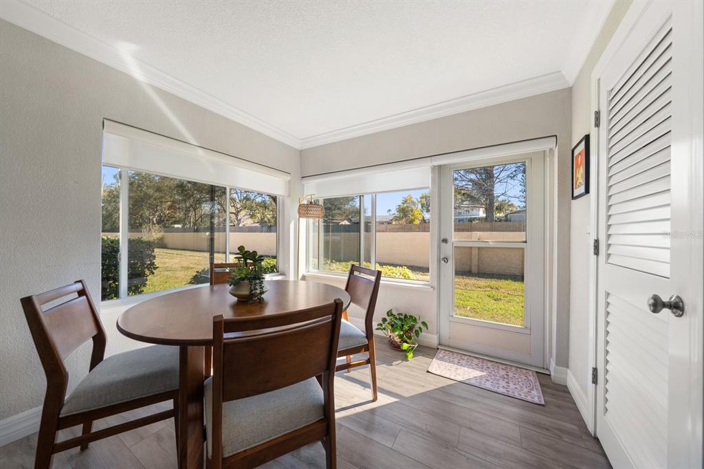 1701 Pinehurst Road, Unit 17G Dunedin, FL 34698 - Photo 9 of 30 a dining room with furniture and a window