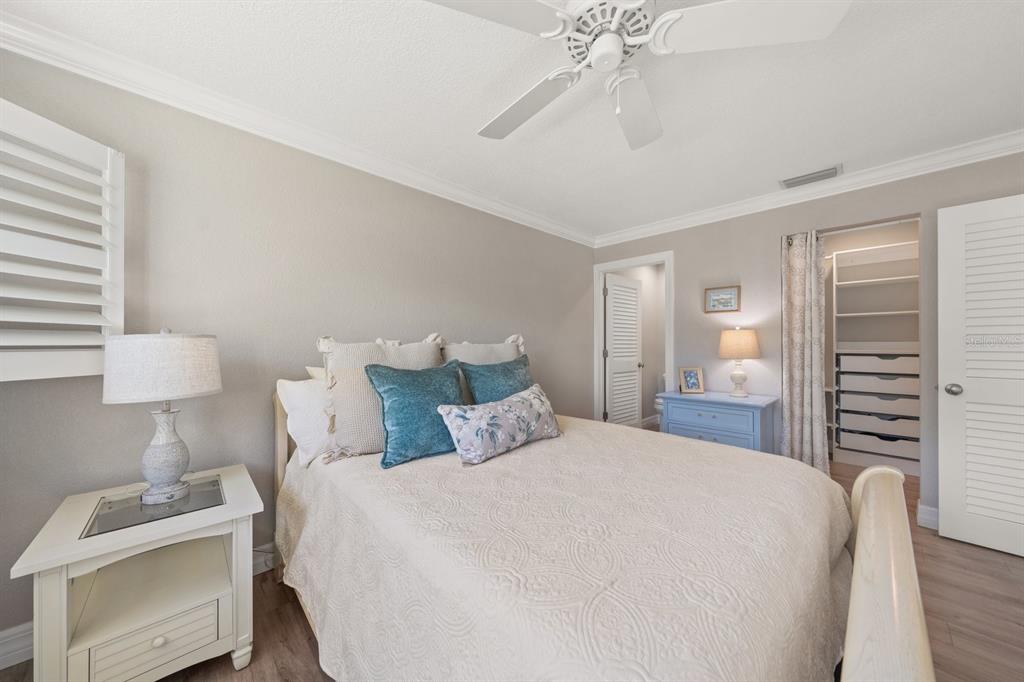 1701 Pinehurst Road, Unit 17G Dunedin, FL 34698 - Photo 10 of 30 a bedroom with a bed and a dresser