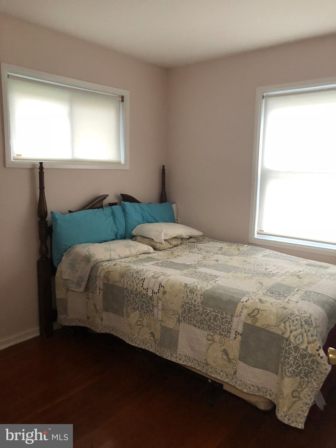 12109 Bluhill Road Silver Spring, MD 20902 - Photo 5 of 6 a bedroom with a bed and a window