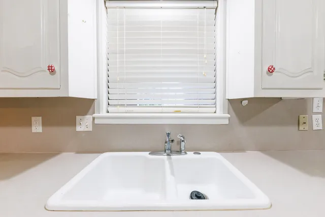 a kitchen with a microwave and cabinets