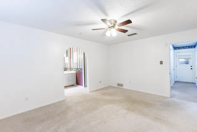 a bathroom with a double vanity sink toilet and a tub
