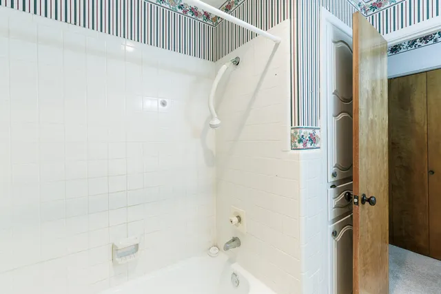 a view of a livingroom with a chandelier fan