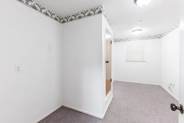 a house with trees in the background