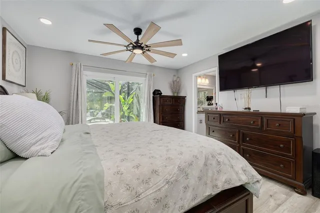 a bedroom with a large bed and a window