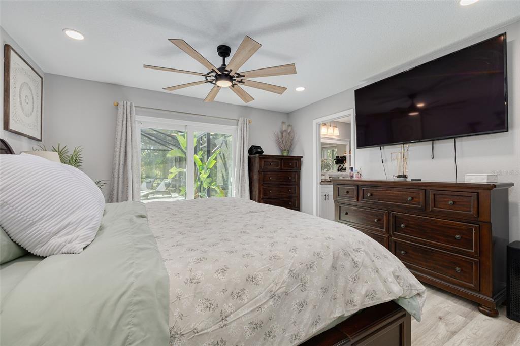 1868 Overview Drive New Port Richey, FL 34655 - Photo 25 of 69 a bedroom with a bed and a flat screen tv