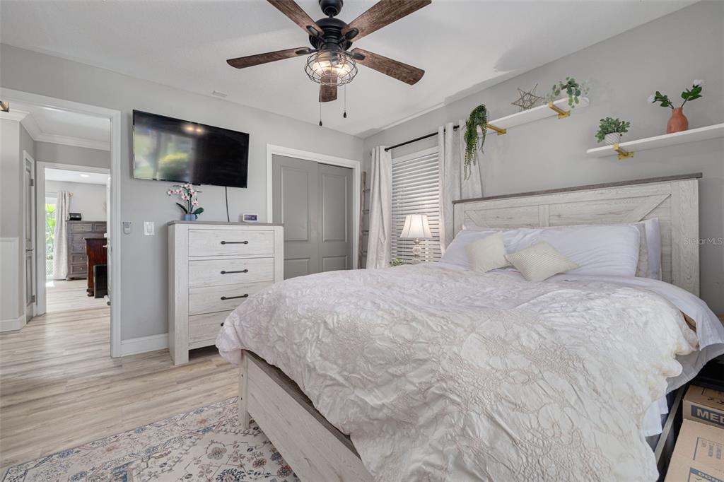 1868 Overview Drive New Port Richey, FL 34655 - Photo 31 of 69 a bedroom with a bed and a flat screen tv