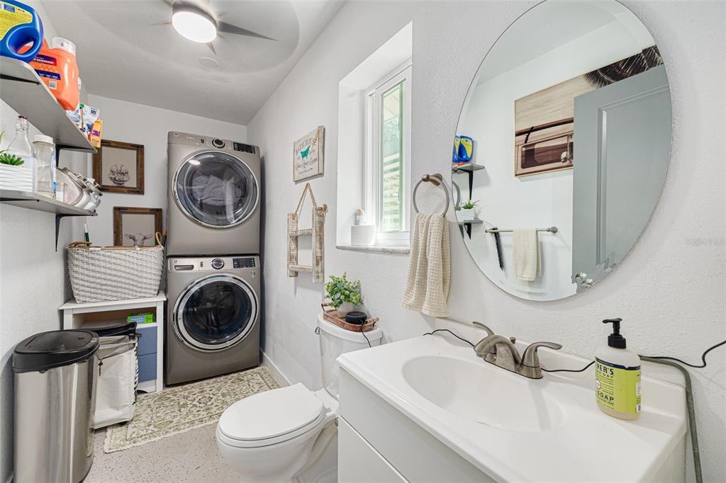 1868 Overview Drive New Port Richey, FL 34655 - Photo 36 of 69 a bathroom with a toilet a sink and a mirror