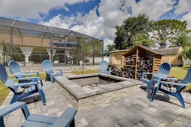 a backyard of a house with yard and outdoor seating