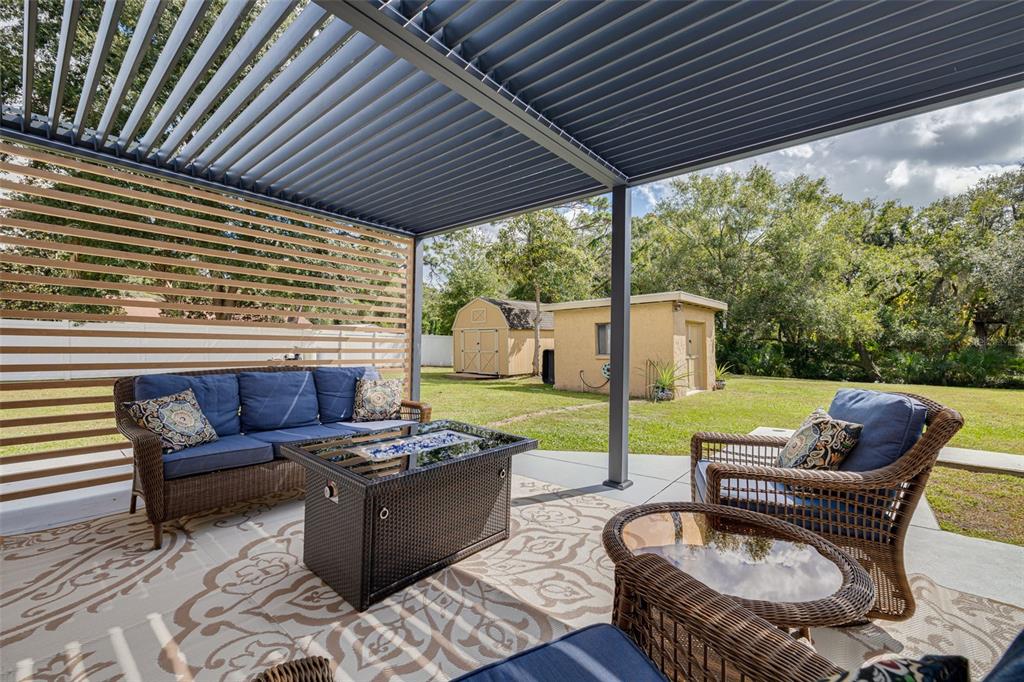 1868 Overview Drive New Port Richey, FL 34655 - Photo 40 of 69 a view of a patio with couches chairs and a table and chairs