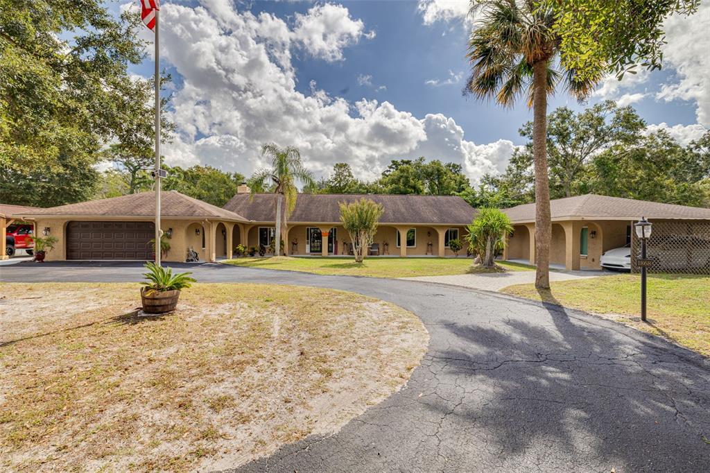 1868 Overview Drive New Port Richey, FL 34655 - Photo 4 of 69 a view of a house with swimming pool and sitting area