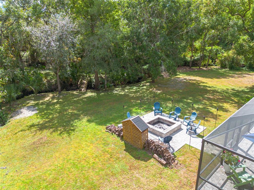 1868 Overview Drive New Port Richey, FL 34655 - Photo 52 of 69 a backyard of a house with yard and outdoor seating