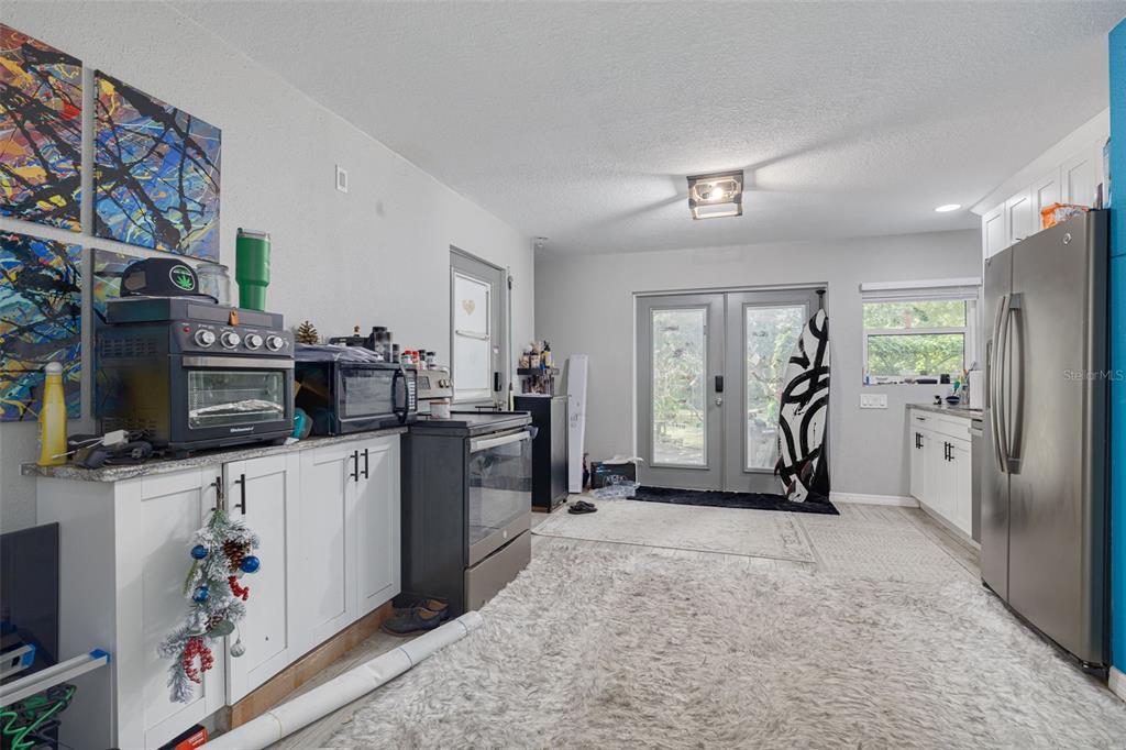 1868 Overview Drive New Port Richey, FL 34655 - Photo 55 of 69 a view of a kitchen with fridge and workspace