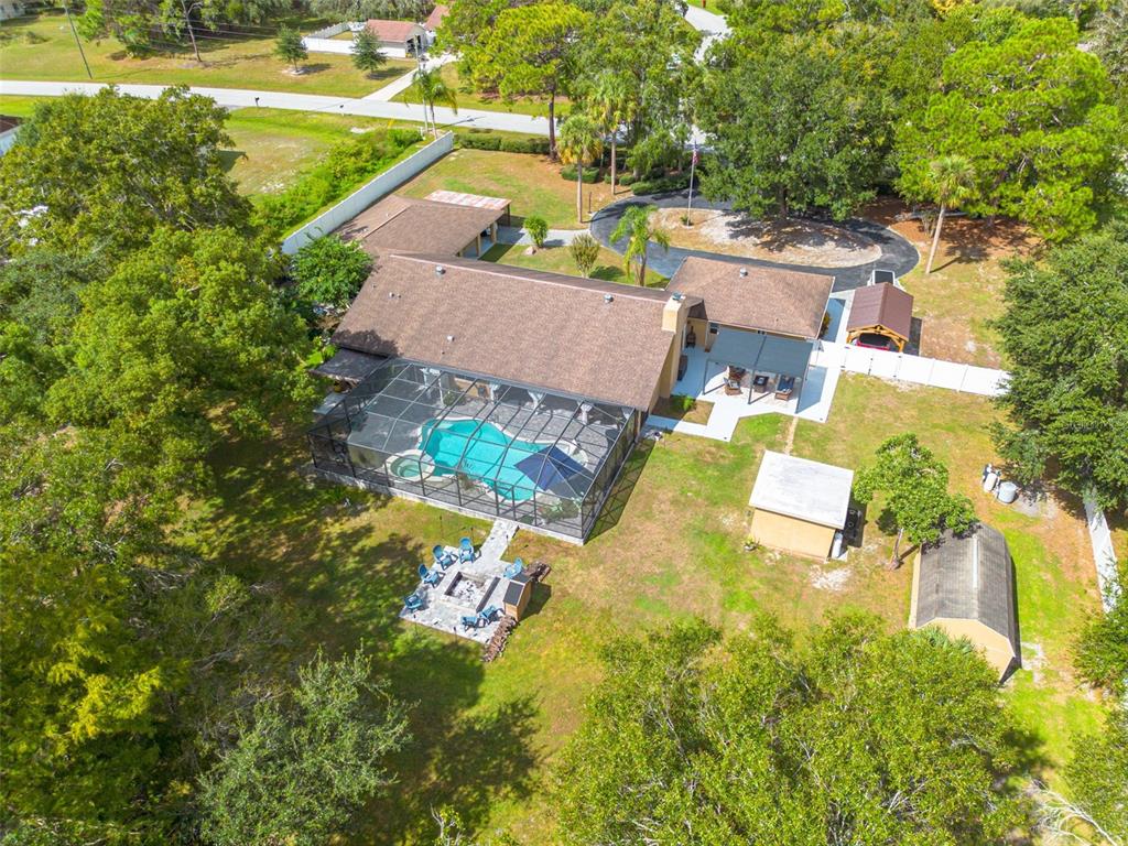 1868 Overview Drive New Port Richey, FL 34655 - Photo 63 of 69 an aerial view of a house with a yard swimming pool and outdoor seating