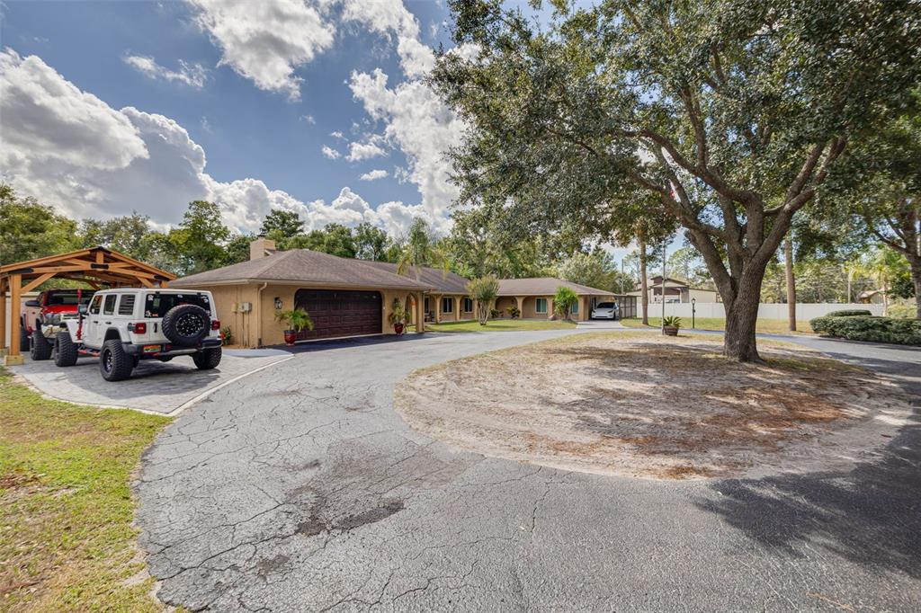 1868 Overview Drive New Port Richey, FL 34655 - Photo 66 of 69 a front view of a house with cars parked