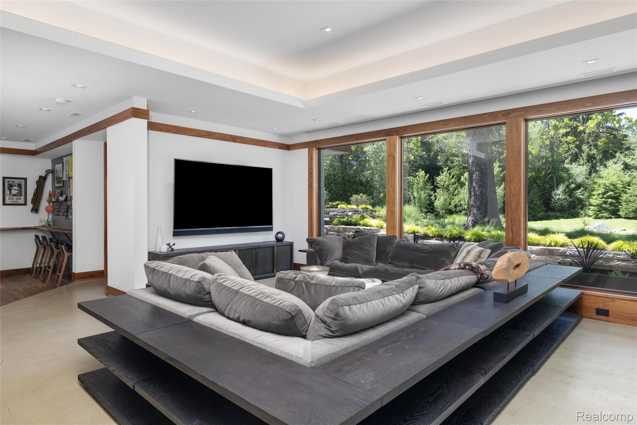 2700 Squirrel Road Bloomfield Hills, MI 48304 - Photo 60 of 83 Sunken living area with extensive floor-to-ceiling windows, perimeter lighting, recessed lighting, and a built-in wet bar