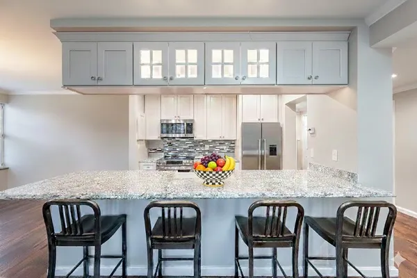 a view of a dining room with furniture and chandelier