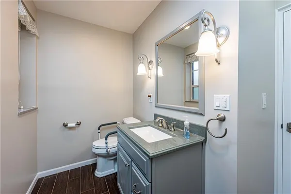 a bathroom with a sink and toilet
