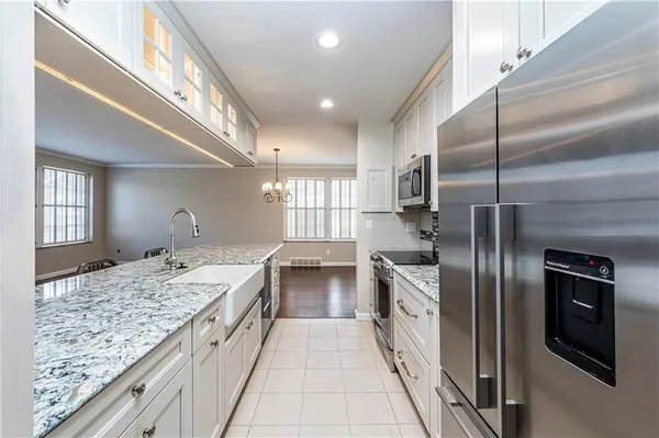 a kitchen with a sink and refrigerator