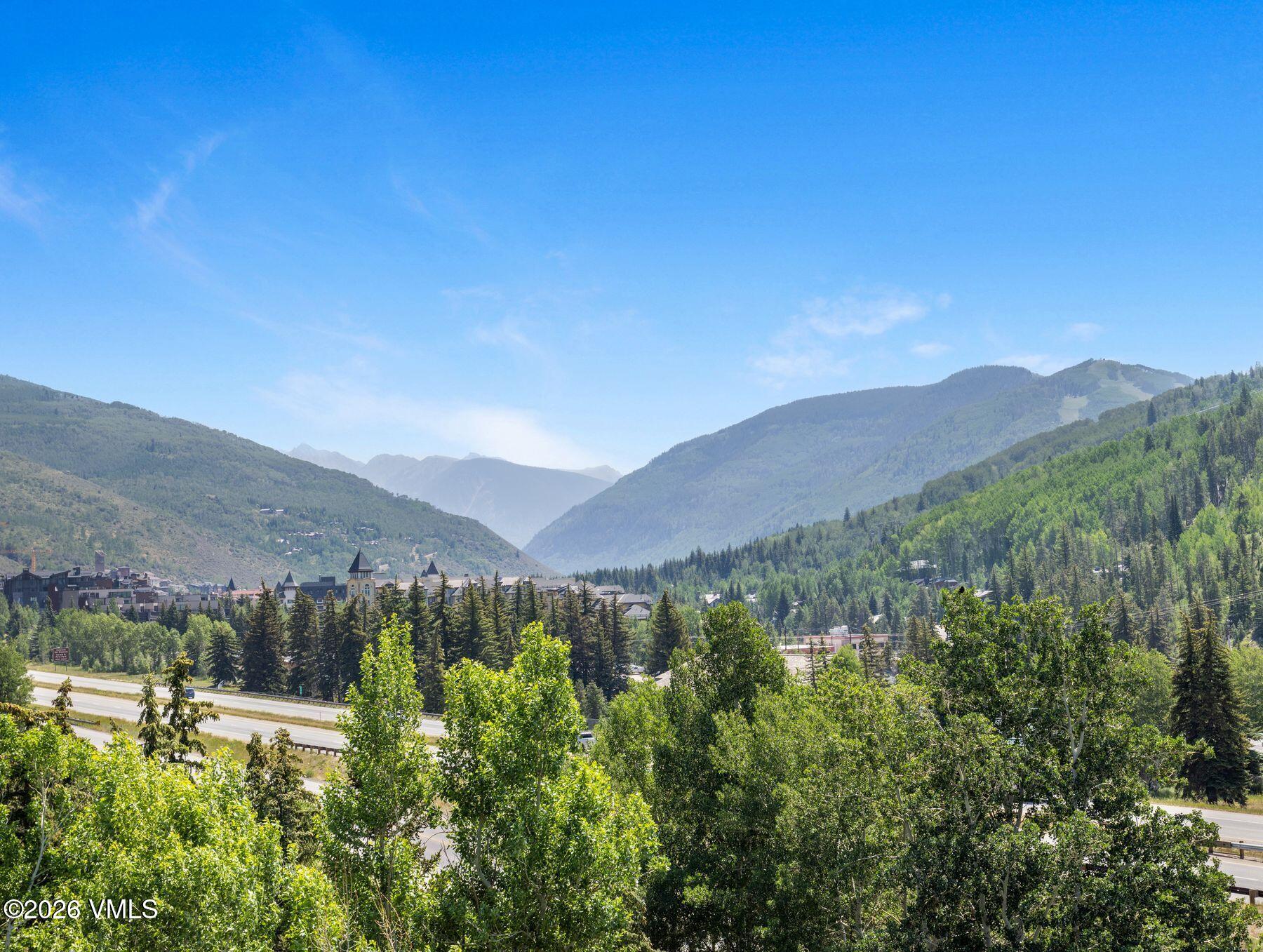 1100 North Frontage Road West, Unit 1503 Vail, CO 81657 - Photo 31 of 32 a view of a town with mountains in the background