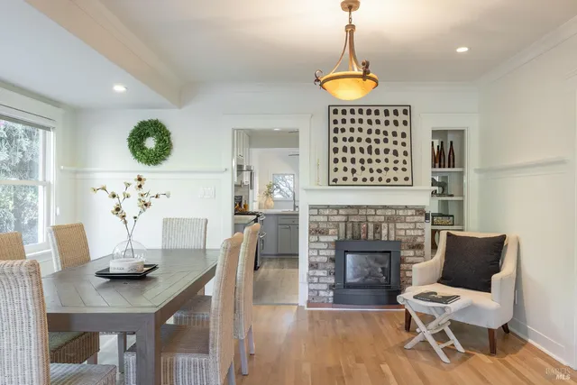 a dining room with furniture and window