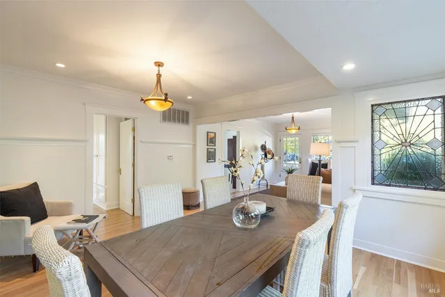 a view of a dining room with furniture window and wooden floor