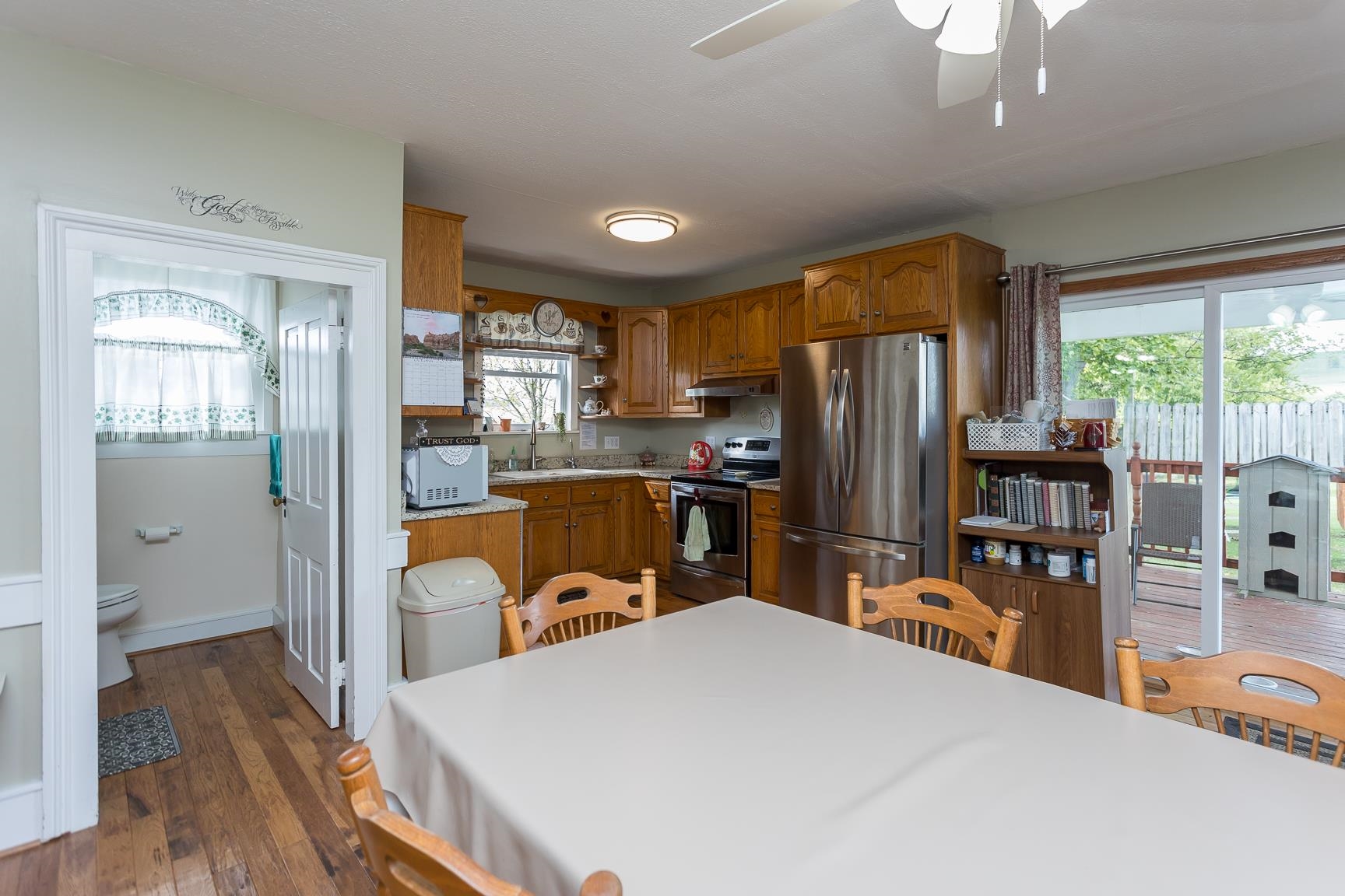 4218 Cross Keys Road Mount Crawford, VA 22841 - Photo 8 of 75 a kitchen with stainless steel appliances granite countertop a refrigerator a stove top oven a sink dishwasher and wooden cabinets with wooden floor