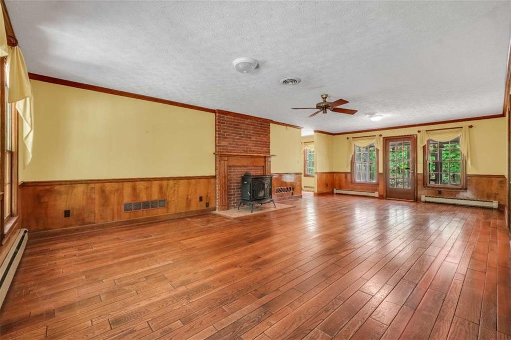 314 Winding Stream Trail Southwest Conyers, GA 30094 - Photo 18 of 59 wooden floor in an empty room with a window