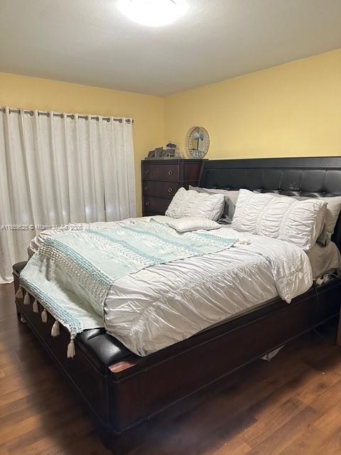 17901 Northwest 68th Avenue, Unit R101 Hialeah, FL 33015 - Photo 12 of 20 a bedroom with bed and window