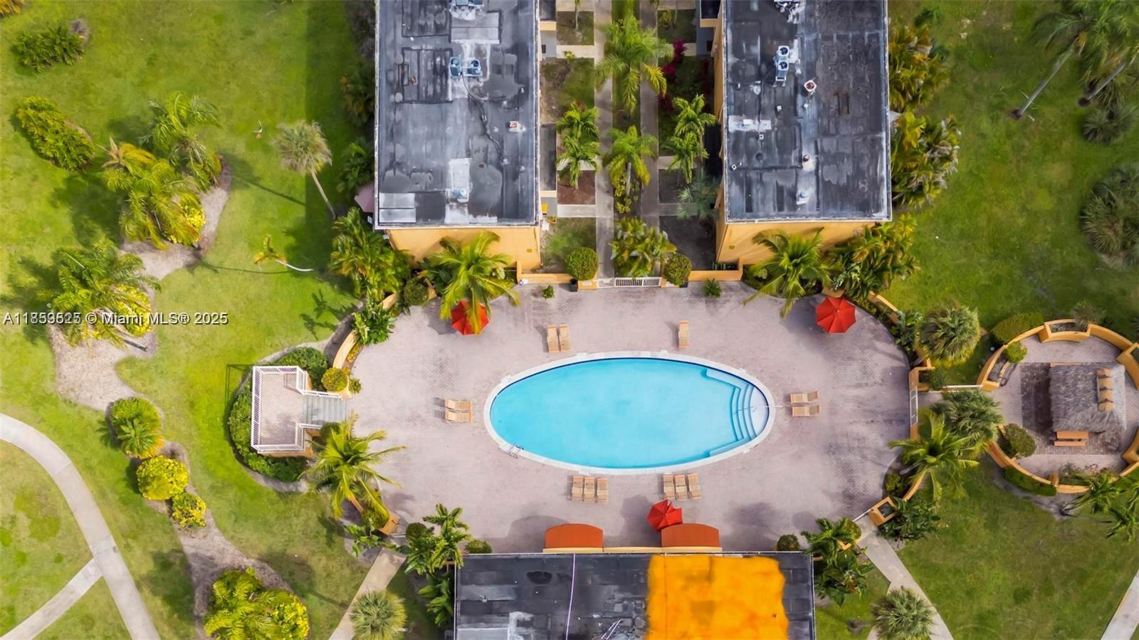 17901 Northwest 68th Avenue, Unit R101 Hialeah, FL 33015 - Photo 17 of 20 an aerial view of a house having outdoor space