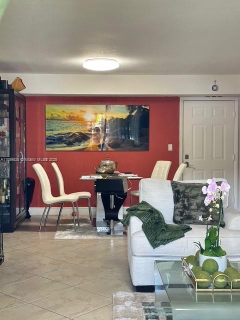 17901 Northwest 68th Avenue, Unit R101 Hialeah, FL 33015 - Photo 3 of 20 a outdoor living space with furniture and a potted plant