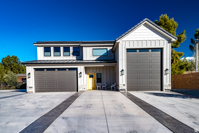 1283 North Gallen Road Santa Clara, UT 84765 - Photo 72 of 103 Modern inspired farmhouse featuring board and batten siding, concrete driveway, a standing seam roof, and covered porch