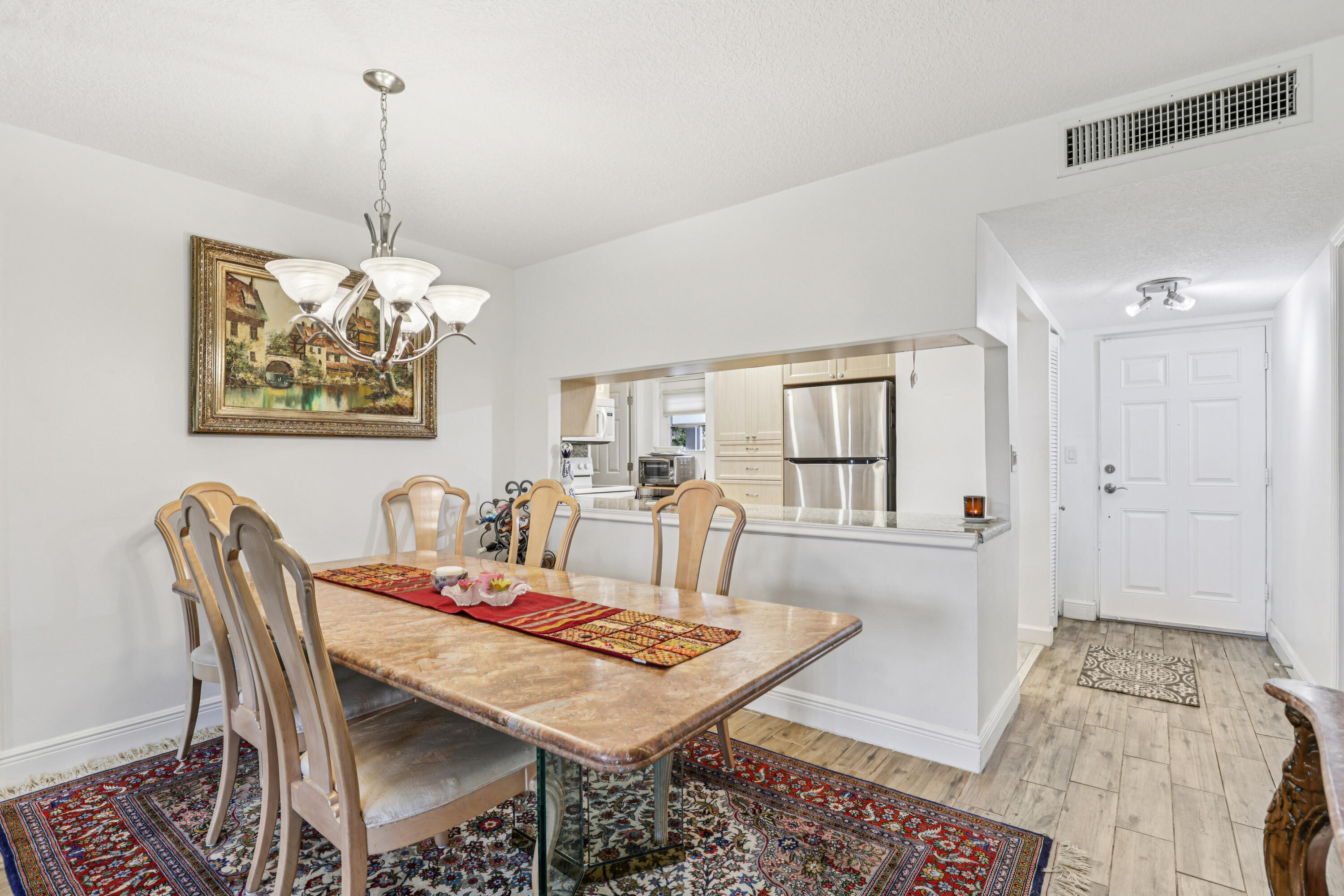 250 Northwest 67th Street, Unit 119 Boca Raton, FL 33487 - Photo 11 of 35 a view of a dining room with furniture