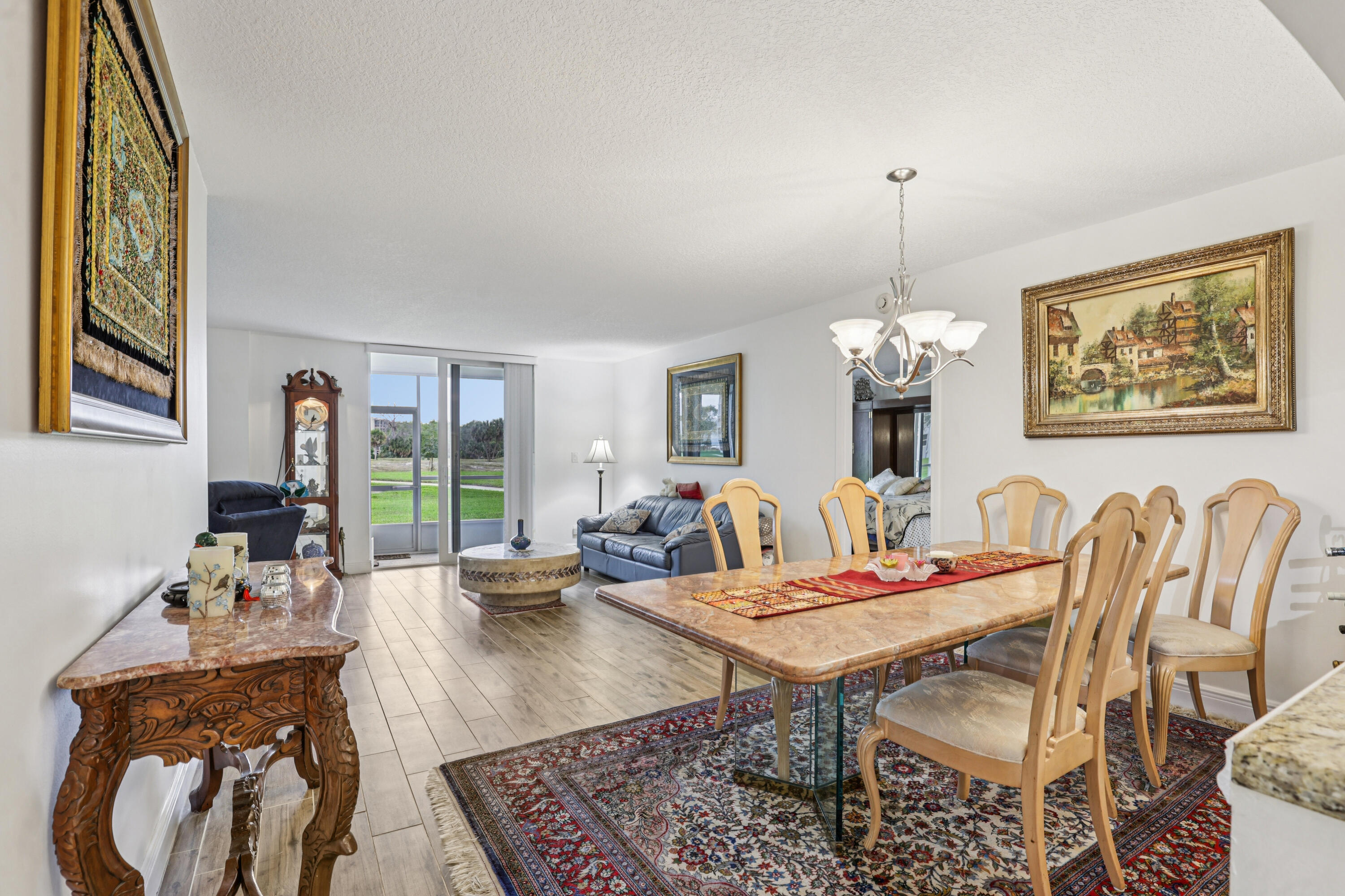 250 Northwest 67th Street, Unit 119 Boca Raton, FL 33487 - Photo 10 of 35 a view of a dining room with furniture