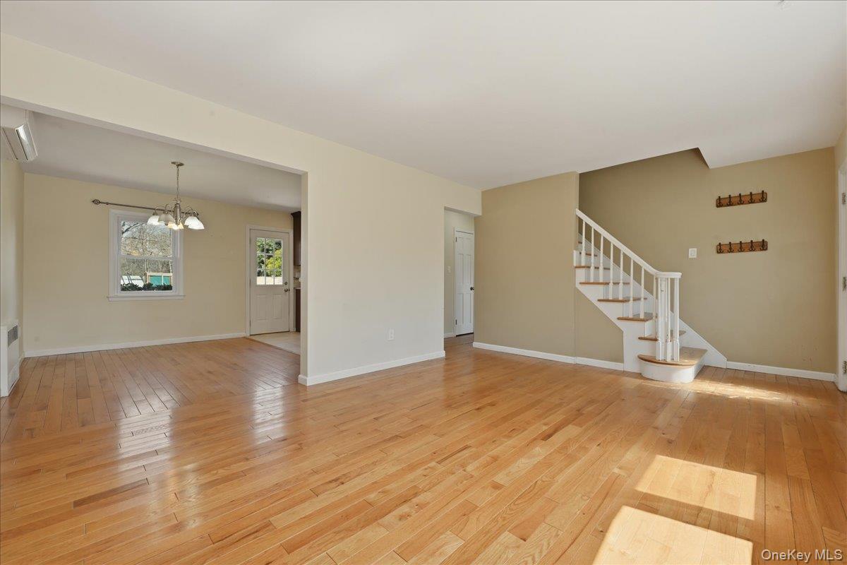 1719 William Street Merrick, NY 11566 - Photo 12 of 38 a view of an empty room with wooden floor and a window